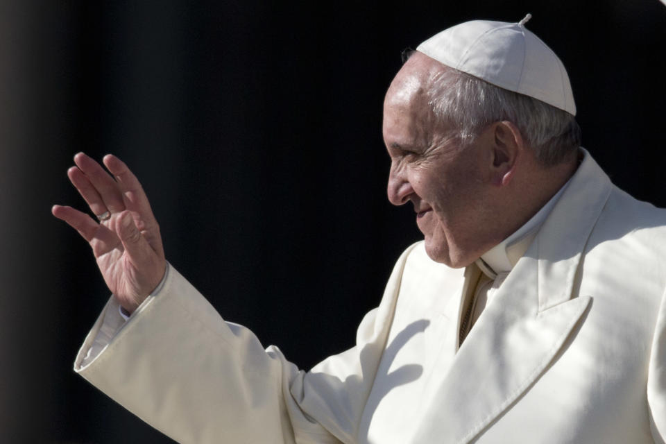 Pope Francis waves as he leaves at the end of his weekly general audience, in St. Peter's Square, at the Vatican, Wednesday, Jan. 15, 2014. (AP Photo/Andrew Medichini)