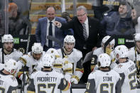 Vegas Golden Knights assistant coach Ryan McGill, right, yells at his players while head coach Peter DeBoer looks on during a timeout late in the third period of an NHL hockey game against the Boston Bruins in Boston, Tuesday, Jan. 21, 2020. The Bruins won 3-2. (AP Photo/Charles Krupa)