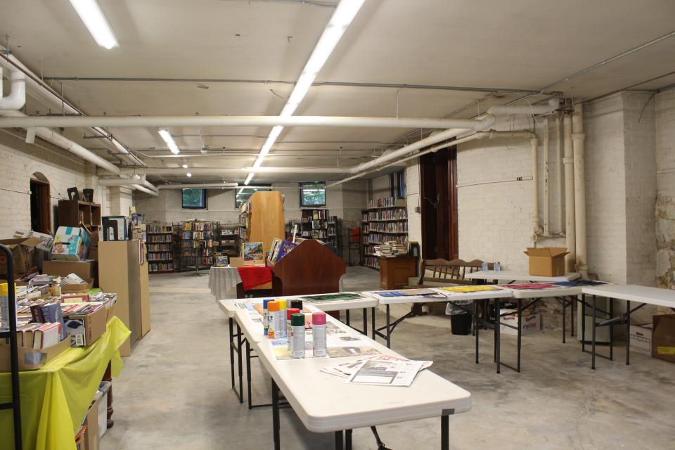 The Beals Memorial Library basement is a space that is currently used for book storage and the Friends of Beals Library's ongoing fundraiser. The co-organizers of Beals con, Chanthachack and Charlonne, both have visions to make the basement space into an improved children's room.