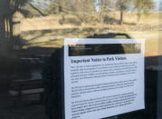 <p>A sign is posted at the Fredericksburg and Spotsylvania National Military Park in Fredericksburg, Va., on Saturday, Jan. 20, 2018, advising visitors that some services would be unavailable due to a government shutdown. Reflected in the window is the Sunken Road, the site of fierce fighting during the Battle of Fredericskburg in 1862. (Photo: Mike Morones/The Free Lance-Star via AP) </p>