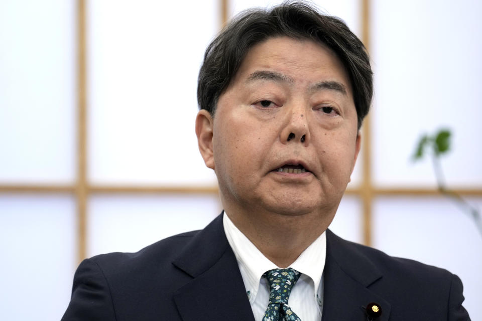 Japanese Foreign Minister Yoshimasa Hayashi speaks to media outlets at his office Monday, March 6, 2023, in Tokyo. South Korea on Monday announced a contentious plan to raise local civilian funds to compensate Koreans who won damages in lawsuits against Japanese companies that enslaved them during World War II. Hayashi told reporters that Japan "appreciates" South Korean announcement and that he hopes political, cultural and economic ties between the two countries would deepen from now on. (AP Photo/Eugene Hoshiko)