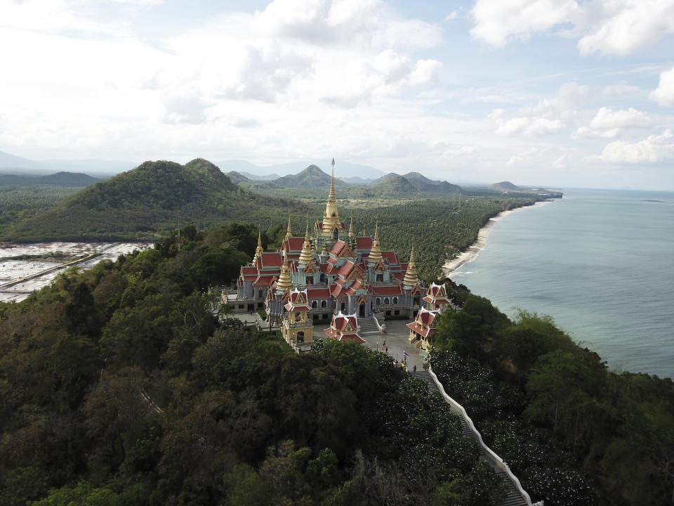 This June 15, 2019 photo shows Wat Tang Sai, a Buddhist temple perched atop Thong Chai Mountain in Ban Krut in the Prachuap Khiri Khan province of Thailand. You won’t find the party scene of Phuket or Pattaya in laid-back Ban Krut, but you will get one of the cleanest and quietest stretches of white sand within driving distance of the capital. (AP Photo/Nicole Evatt)