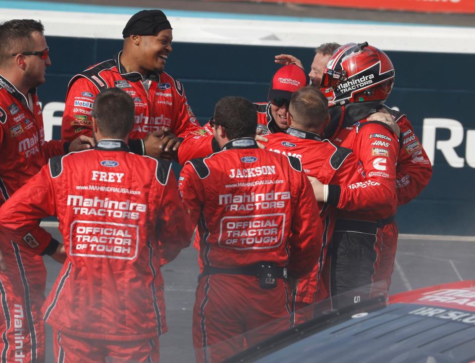 Mitchell's Chase Briscoe (in helmet) celebrates with his pit crew after winning the Ruoff Mortgage 500 for Stewart/Haas Racing at Phoenix Raceway.