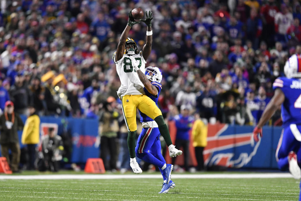 Green Bay Packers wide receiver Romeo Doubs (87) makes a catch against Buffalo Bills cornerback Taron Johnson (7) during the second half of an NFL football game Sunday, Oct. 30, 2022, in Orchard Park. (AP Photo/Adrian Kraus)