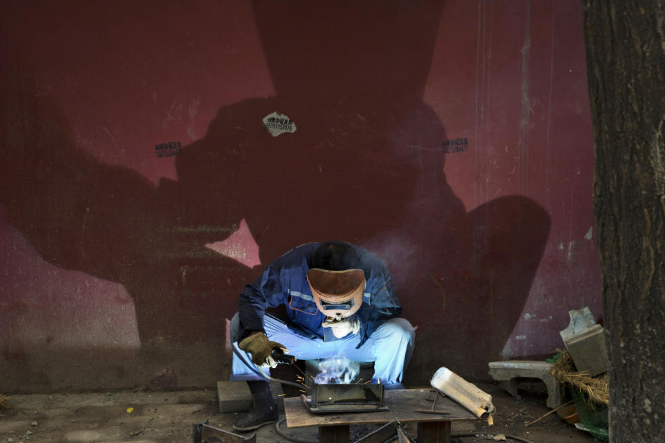 Working a weld in Beijing