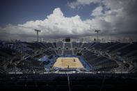 The sand is empty during first women's beach volleyball match of the 2020 Summer Olympics between Japan and Czech Republic after it was canceled, Saturday, July 24, 2021, in Tokyo, Japan. The Czech team says beach volleyball player Markéta Sluková has entered a quarantine hotel after testing positive for COVID-19. (AP Photo/Felipe Dana)