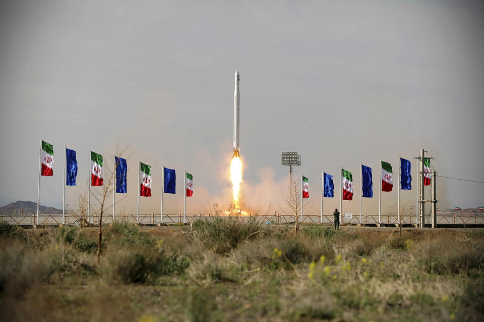 In this photo released Wednesday, April 22, 2020, by Sepahnews, an Iranian rocket carrying a satellite is launched from an undisclosed site believed to be in Iran's Semnan province. Iran's Revolutionary Guard said Wednesday it put the Islamic Republic's first military satellite into orbit, dramatically unveiling what experts described as a secret space program with a surprise launch that came amid wider tensions with the United States. (Sepahnews via AP)