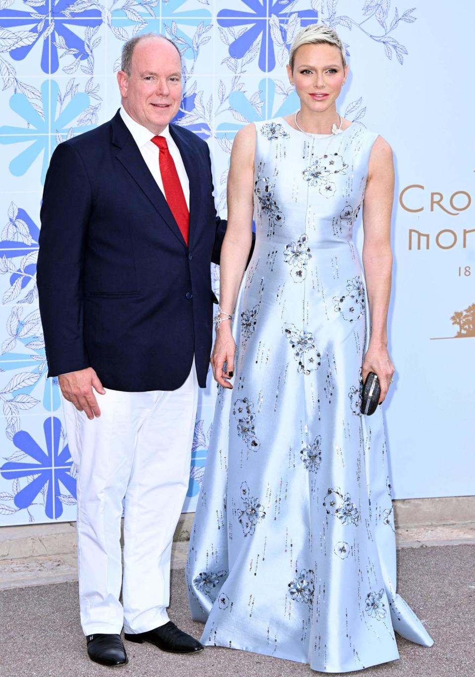 <p>Each year, Monaco's royal family goes glam for the <a href="https://people.com/royals/princess-charlene-prince-albert-monaco-red-cross-gala/" rel="nofollow noopener" target="_blank" data-ylk="slk:Red Cross Gala;elm:context_link;itc:0;sec:content-canvas" class="link ">Red Cross Gala</a>, and 2022 was no exception. Princess Charlene wore a full-length ice blue satin ballgown by Prada, lightly embroidered with crystals in a floral motif. Keeping jewelry to a minimum, she accessorized her outfit with a Flying Butterfly necklace from Van Cleef and Arpels.</p>