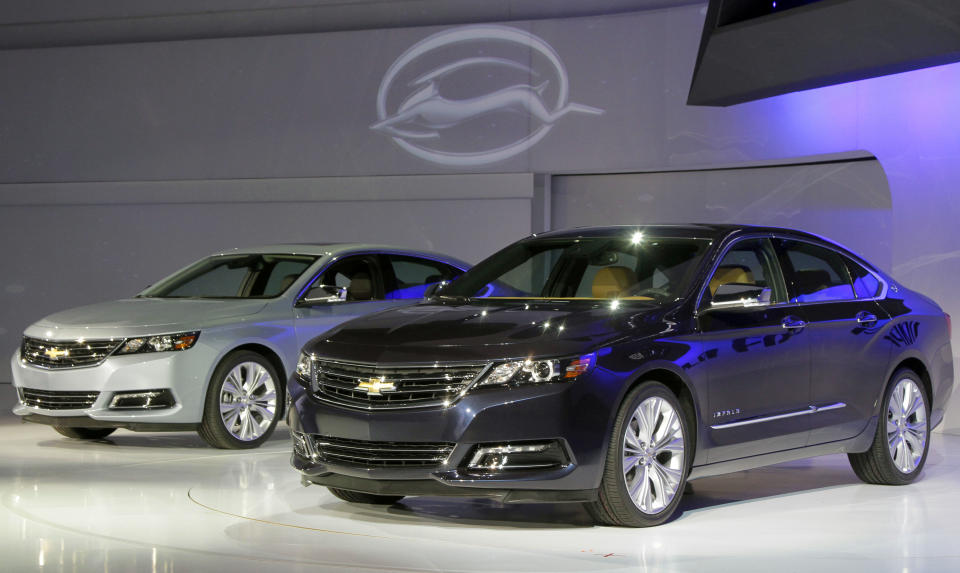 Two 2013 Chevrolet Impalas are unveiled at the New York International Auto Show, in New York's Javits Center, Wednesday, April 4, 2012. General Motors Co.'s Chevrolet brand is trying to resuscitate sales of big sedans with a sleek, new version of the Impala. (AP Photo/Richard Drew)