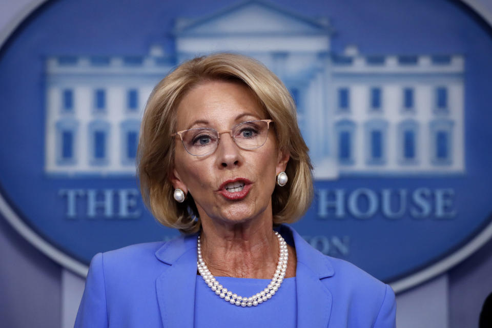 FILE - In this March 27, 2020, file photo, Education Secretary Betsy DeVos speaks about the coronavirus in the James Brady Press Briefing Room in Washington. A half-dozen senior advisers to President Donald Trump have repeatedly voted by mail, according to election records obtained by The Associated Press, undercutting the president’s argument that the practice will lead to widespread fraud this November. The aides include DeVos, who has permanent absentee voting status in her home state of Michigan. (AP Photo/Alex Brandon, File)