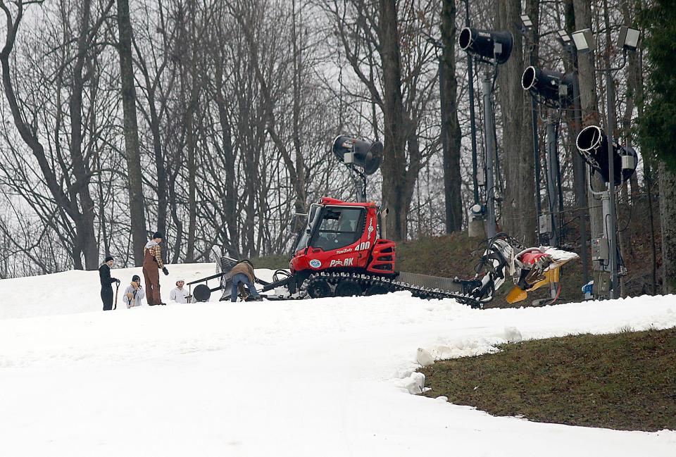 Snow Trails employees work to get the slopes in condition for their opening on Friday on Thursday, Dec. 8, 2022. TOM E. PUSKAR/ASHLAND TIMES-GAZETTE