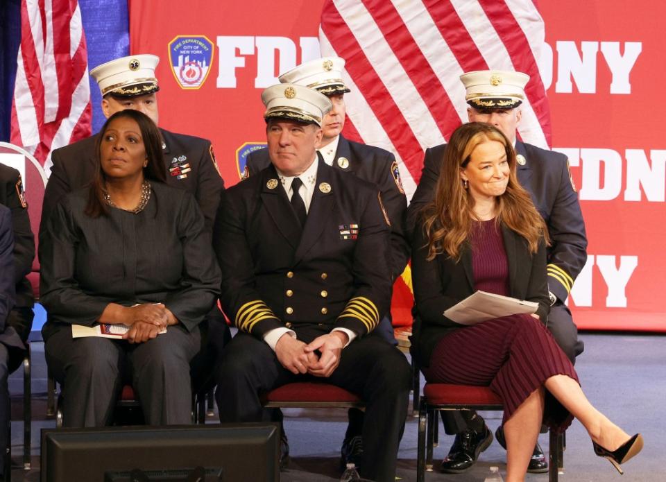 Letitia James, John Hodgens and Fire Commissioner Laura Kavanagh (sitting in front) during the promotion ceremony. BRIGITTE STELZER
