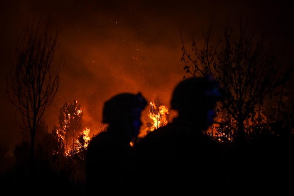 Firefighters are at work to extinguish a wildfire in Cardigos village in Macao, central Portugal on July 21, 2019. (Photo: Patricia De Melo Moreira/AFP/Getty Images)