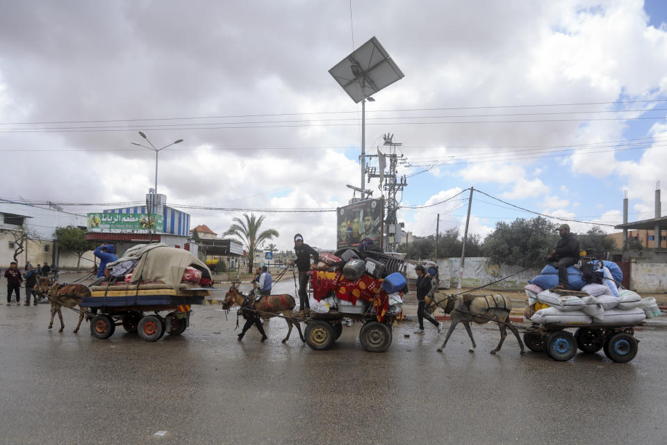 Palestinians flee from the eastern side of the southern Gaza city of Rafah after the Israeli army orders them to evacuate ahead of a military operation, in Rafah, Gaza Strip, Monday, May 6, 2024. The order affects tens of thousands of people and could signal a broader invasion of Rafah, which Israel has identified as Hamas' last major stronghold after seven months of war. (AP Photo/Ismael Abu Dayyah)