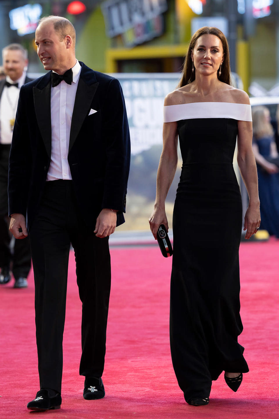 <p>The royals went black-and-white glam for the evening, with William in a tux (and <a href="https://people.com/royals/kate-middleton-prince-william-hit-red-carpet-top-gun-maverick-premiere/" rel="nofollow noopener" target="_blank" data-ylk="slk:loafers embroidered" class="link ">loafers embroidered</a> with F-18 planes!) and Kate in an off-the-shoulder gown by Roland Mouret</p>