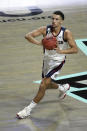 Gonzaga guard Joel Ayayi (11) looks to pass the ball against Saint Mary's during the first half of an NCAA semifinal college basketball game against Saint Mary's at the West Coast Conference tournament Monday, March 8, 2021, in Las Vegas. (AP Photo/David Becker)