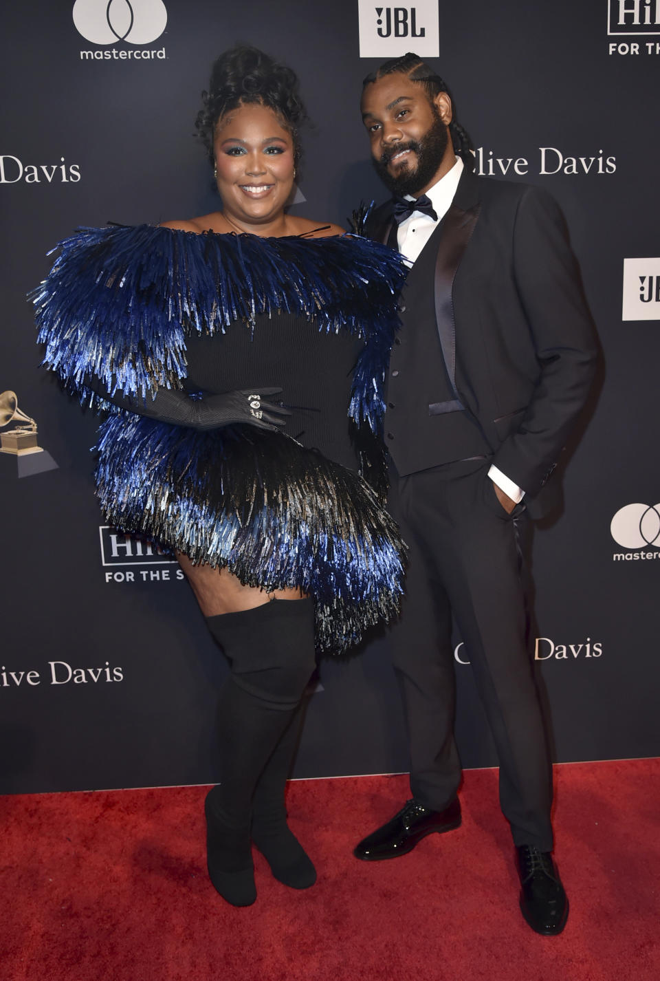 Lizzo, left, and Myke Wright arrive at the Pre-Grammy Gala on Saturday, Feb. 4, 2023, at the Beverly Hilton Hotel in Beverly Hills, Calif. (Photo by Richard Shotwell/Invision/AP)