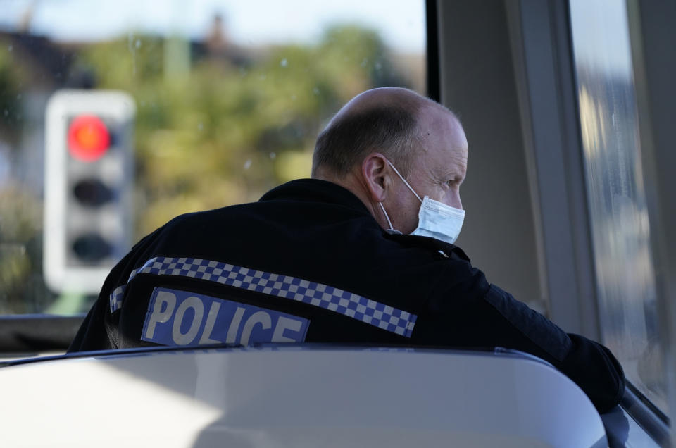 EMBARGOED UNTIL 1500 THURSDAY FEBRUARY 17 An officer from Dorset Police sits at the front of double decker bus as he observes driver behaviour, including motorists using their mobile phones whilst driving, during the force's 'Op Decker' mobile phone at the wheel enforcement operation, in Bournemouth, Dorset. Picture date: Thursday February 17, 2022.