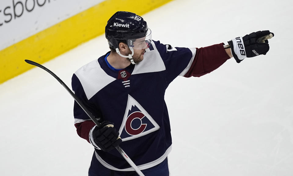 Colorado Avalanche left wing Jonathan Drouin gestures after scoring a goal in the first period of an NHL hockey game against the Nashville Predators, Saturday, March 30, 2024, in Denver. (AP Photo/David Zalubowski)