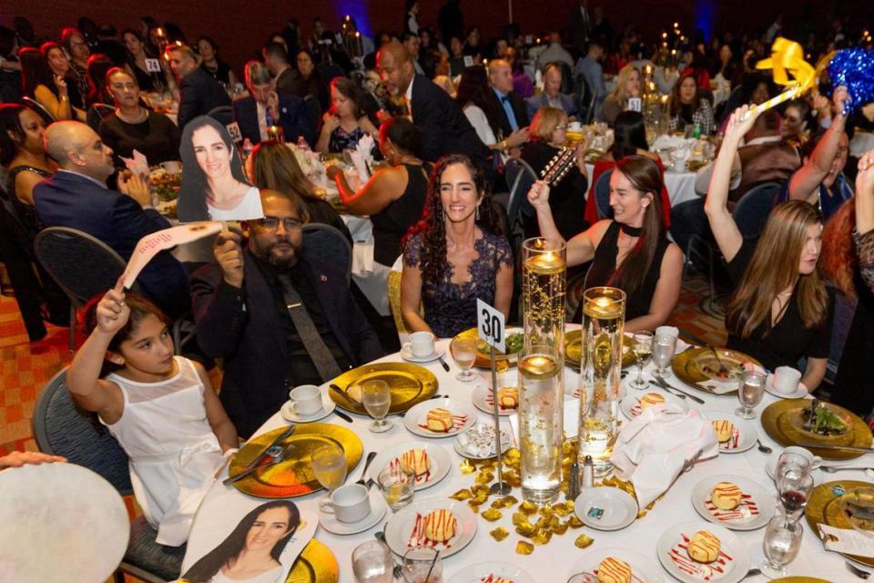 Melissa Abril-Dotel, 40, who teaches second grade at North Beach Elementary, reacts with family and friends after being recognized as a finalist for the 2025 Francisco R. Walker Teacher of the Year for Miami-Dade Schools, during a banquet at Miami Airport & Convention Center on Tuesday, January 23, 2024.