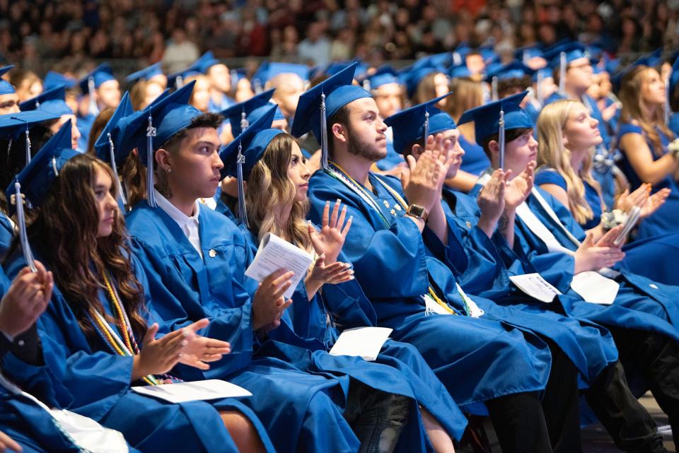 Pueblo Central High School graduates clap for a speaker during the school's commencement ceremony on Saturday, May 27, 2023.