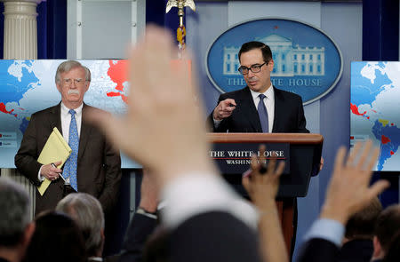 FILE PHOTO: U.S. Treasury Secretary Steven Mnuchin and White House National Security Adviser John Bolton announce economic sanctions against Venezuela and the Venezuelan state owned oil company Petroleos de Venezuela (PdVSA) during a press briefing at the White House in Washington, U.S., January 28, 2019. REUTERS/Jim Young/File Photo