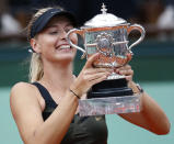 Russia's Maria Sharapova holds a trophy on the podium after winning against Italy's Sara Errani their Women's Singles final tennis match of the French Open tennis tournament at the Roland Garros stadium, on June 9, 2012 in Paris. AFP PHOTO / THOMAS COEXTHOMAS COEX/AFP/GettyImages