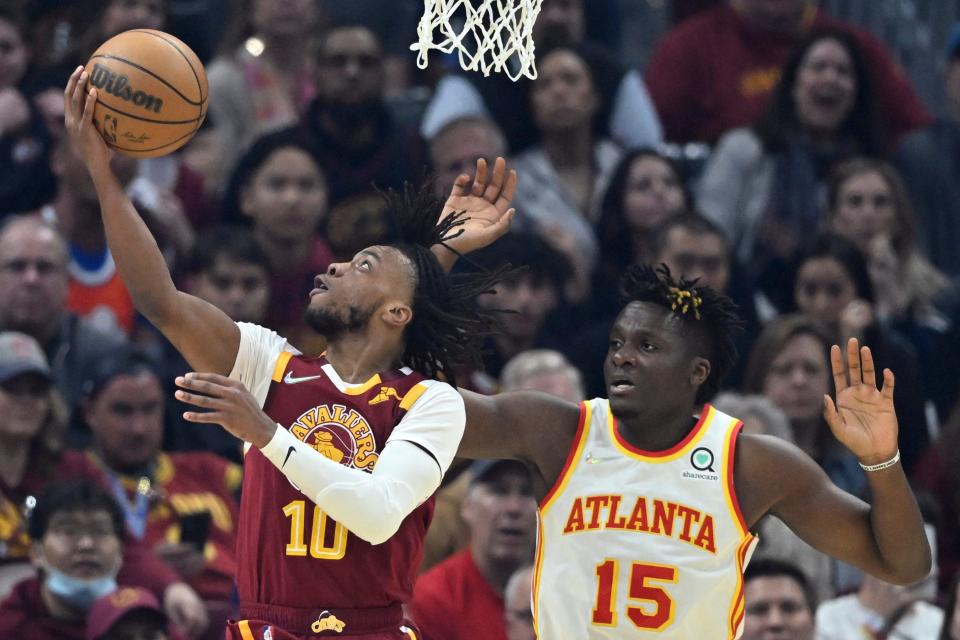 Play-in tournament: Cavaliers guard Darius Garland (10) drives for a layup past Hawks defender Clint Capela (15) during the first half.