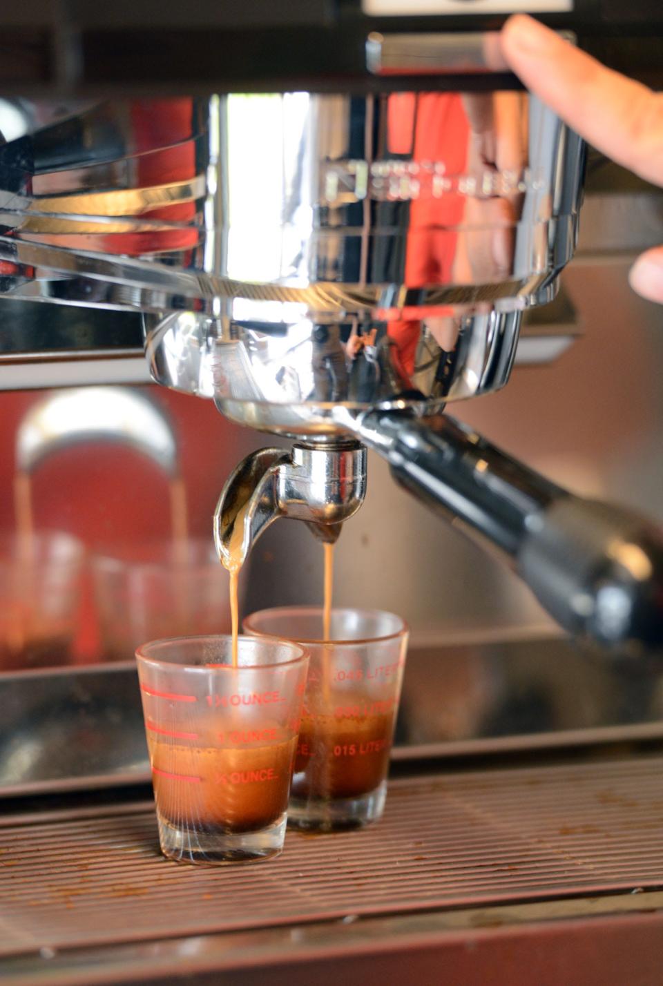 Adriana Mellas makes two espresso shots for a latte inside Drica's Favorites Specialty Coffee Boutique, a mobile food truck serving specialty coffees and baked goods, in Lakeland, FL on Monday June 3, 2013.  Scott Wheeler/The Ledger