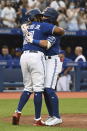 Toronto Blue Jays' Bo Bichette (11) celebrates his two-run home run against the Cleveland Indians with Vladimir Guerrero Jr. during the fourth inning of a baseball game Thursday, Aug. 5, 2021, in Toronto. (Jon Blacker/The Canadian Press via AP)