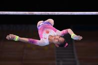 <p>China's Xijing Tang competes in the uneven bars event of the artistic gymnastics women's all-around final during the Tokyo 2020 Olympic Games at the Ariake Gymnastics Centre in Tokyo on July 29, 2021. (Photo by Martin BUREAU / AFP) (Photo by MARTIN BUREAU/AFP via Getty Images)</p> 