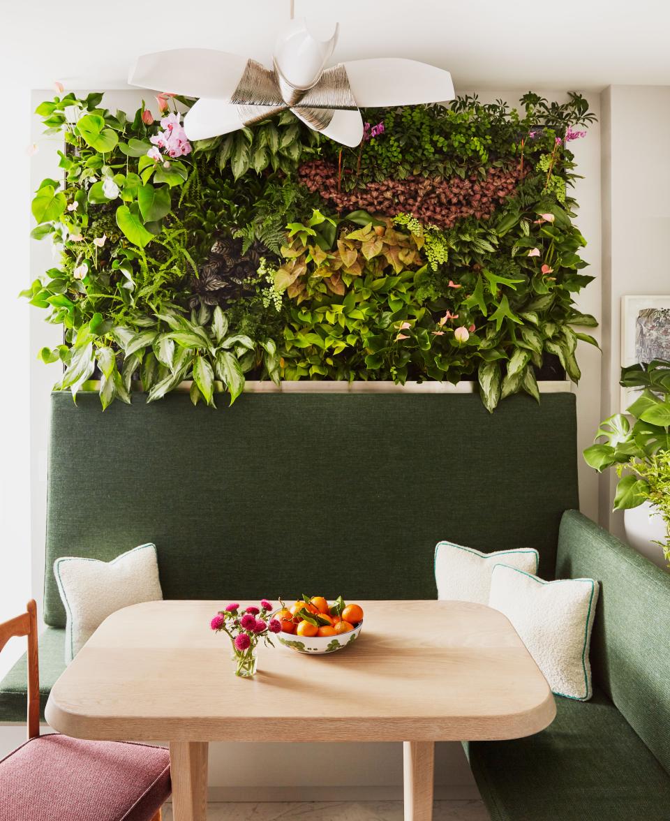 Plants—and plenty of them—are an essential component of Forsblom’s design. It all starts with this self-irrigating living wall by Plant Wall Design in the breakfast room. The custom banquette wears a Brochier outdoor fabric from Angela Brown Ltd. Custom oak breakfast table. Chandelier from Circa Lighting.