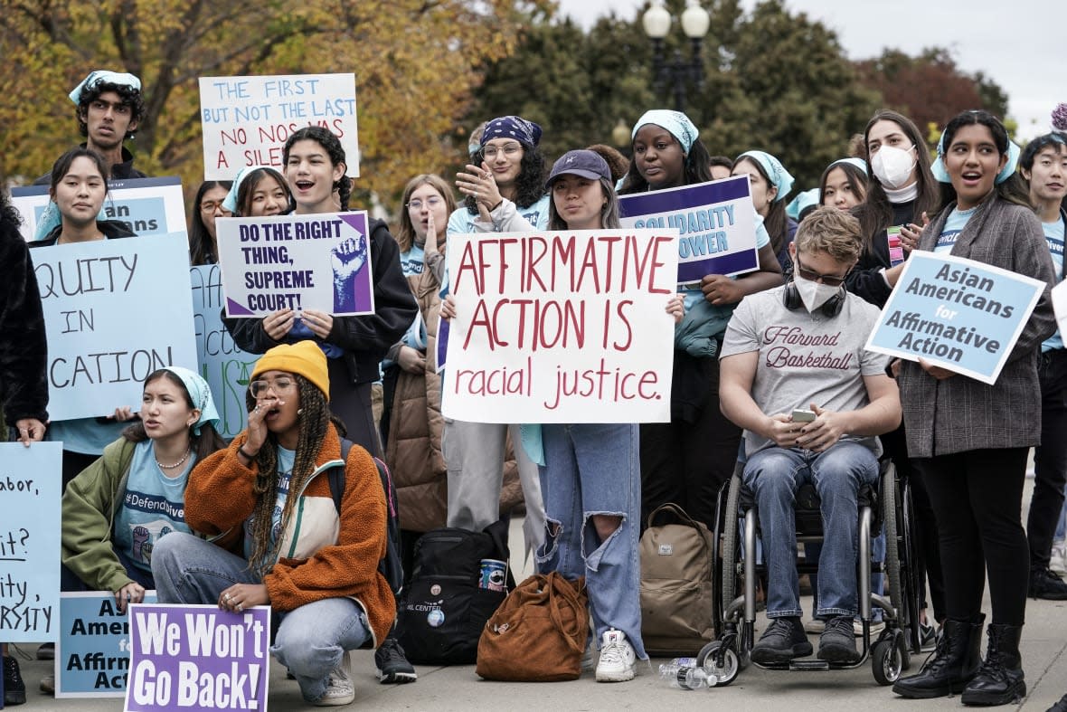 FILE – Activists demonstrate as the Supreme Court hears oral arguments on a pair of cases that could decide the future of affirmative action in college admissions, in Washington, Oct. 31, 2022. As the Supreme Court decides the fate of affirmative action, most Americans say the court should allow consideration of race as part of the admissions process, yet few believe students’ race should play a significant role in decisions. (AP Photo/J. Scott Applewhite, File)