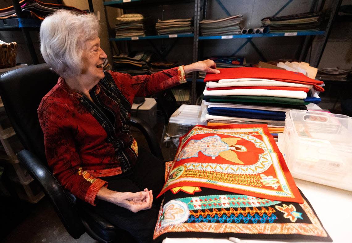 M’Lou Bancroft sorts through pillow cases for Honduras Threads Wednesday, Oct. 26, 2022, in Dallas. Honduras Threads works with women in Honduras who create the products for customers in United States.