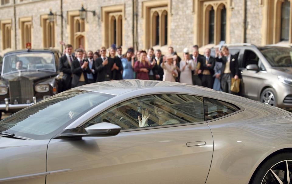 The newlyweds leave Windsor in the sports car (AFP/Getty Images)