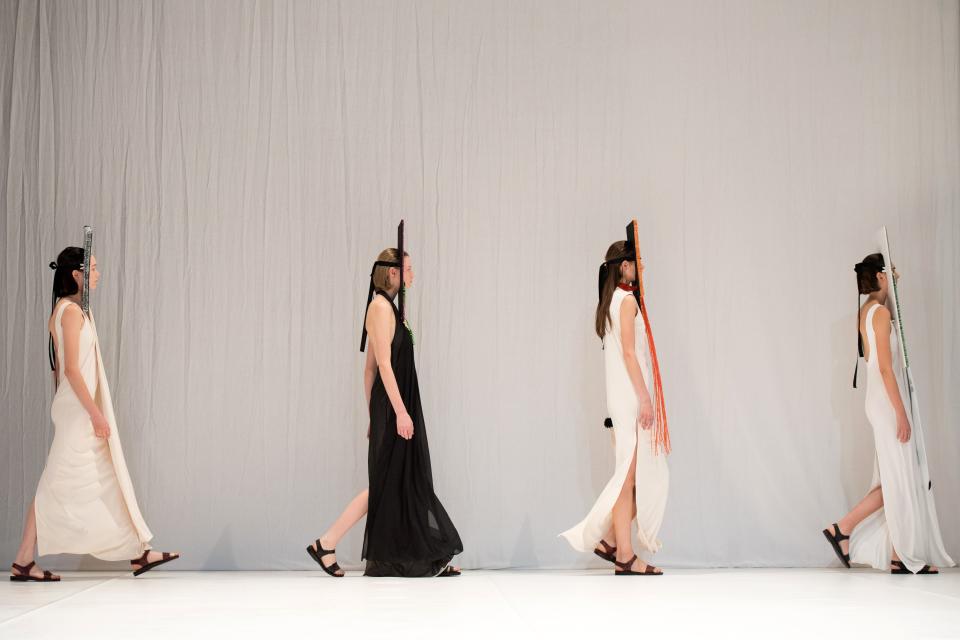 The models walking out to take their places.&nbsp; (Photo: CHRIS J RATCLIFFE via Getty Images)