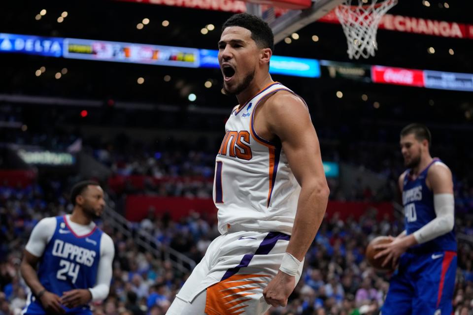 Phoenix Suns guard Devin Booker (1) reacts after dunking the ball during Game 3 of the Western Conference First Round Playoffs at Crypto.com Arena in Los Angeles on April 20, 2023.