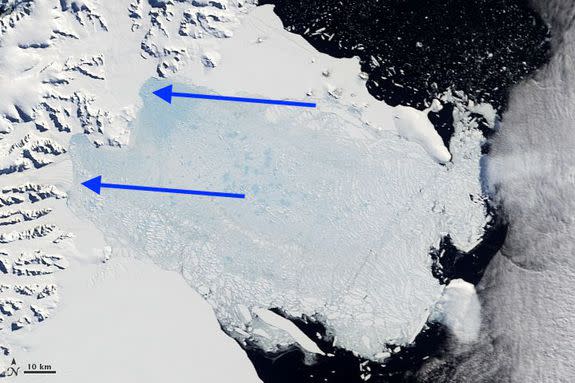 Larsen B Ice Shelf after the disintegration on March 7, 2002, with arrows showing the retreat of the edge of the shelf and shelf remnants extending from it.