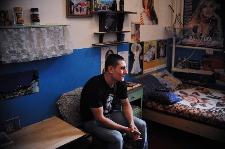 Inmate Sevdalin Strahilov, 20, sits in his room at Boychinovtsi Correctional Home, in north-west Bulgaria