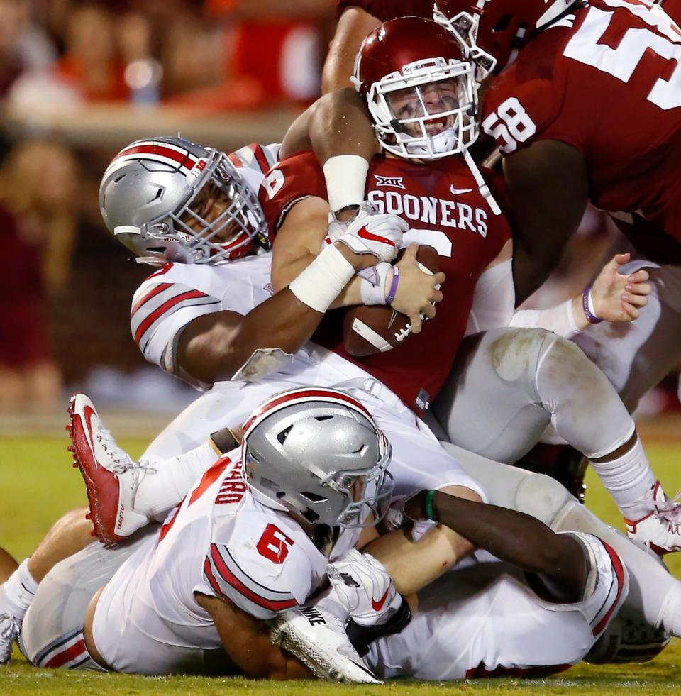 Ohio State's Sam Hubbard (6) and Dre'Mont Jones (86) tackle OU quarterback Baker Mayfield in a 2016 game. Will non-conference showdowns become obsolete when the Sooners enter the SEC?