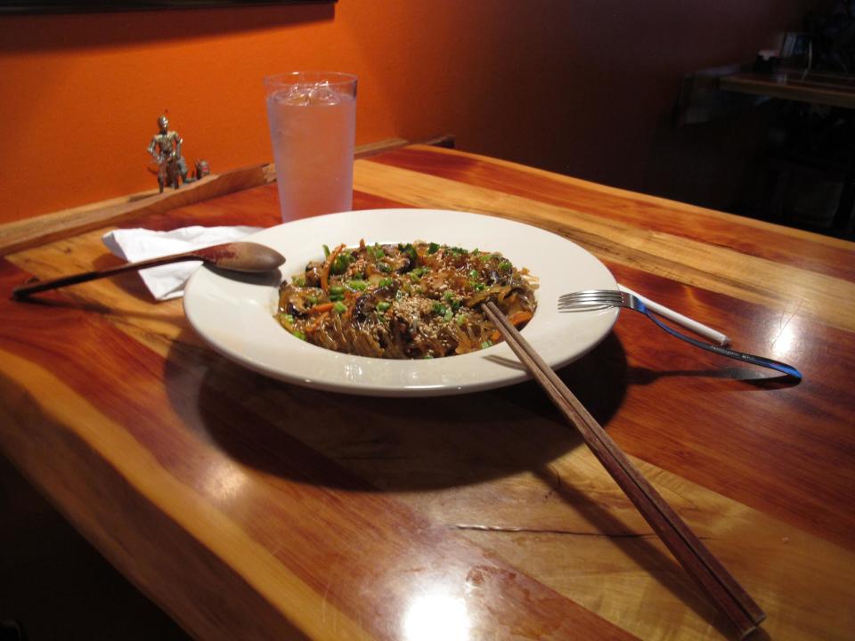 This Dec. 22, 2013 photo shows a steaming-hot dish of sweet potato noodles, carrots, mushrooms and onions in a spicy sauce at Crazy Noodle restaurant in Memphis, Tenn. (AP Photo/Adrian Sainz)
