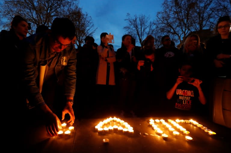 People light candles during a demonstration for justice on the Place de la Republique on March 30, 2017 following the death of Chinese Liu Shaoyo during a police intervention