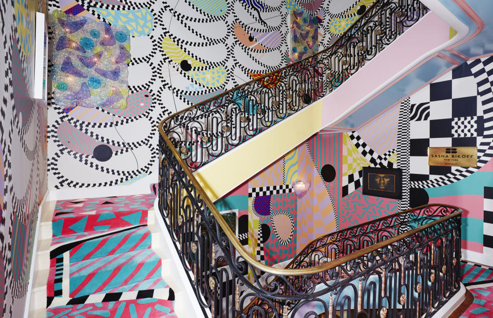 This undated photo shows the staircase inside the Kips Bay Showhouse in New York. New York-based designer Sasha Bikoff created the exuberant showstopper of a staircase for 2018's Kip's Bay Showhouse in Manhattan. Using Memphis Milano designers Ettore Sottsass and Alessandro Mendinii as her inspiration, the space was filled with brights and pastels, mirrors, and a riot of pattern. The designer encourages home decorators to "be fearless," and that confident, positive attitude is at the heart of the 70s/80s décor trend.(Genevieve Garrupo/Sasha Bikoff via AP)