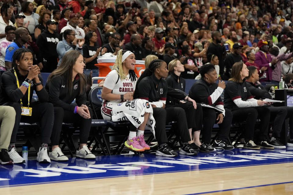 South Carolina guard Te-Hina Paopao is the lone player on the bench after players were ejected after an altercation during the second half of an NCAA college basketball game against LSU at the Southeastern Conference women's tournament final Sunday, March 10, 2024, in Greenville, S.C. (AP Photo/Chris Carlson)