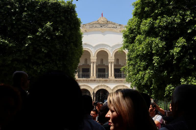 Journalists protest outside the Palace of Justice in Tunis