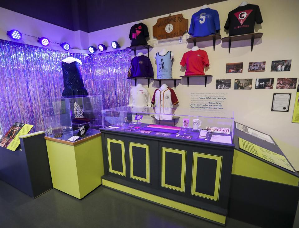 Memorabilia from various Green Bay area LGBTQ+ bars is seen in the "Telling Our Stories" exhibit on Thursday at the Neville Public Museum in Green Bay. The exhibit highlights the LGBTQ+ community's history in the Green Bay area.