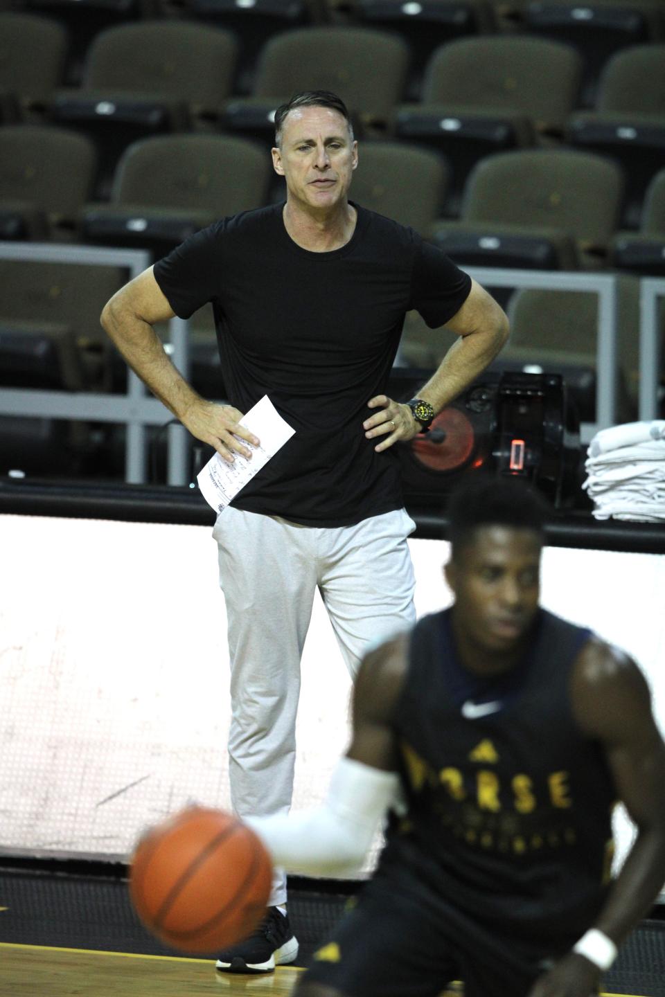 NKU head coach Darrin Horn observes his players in practice as Northern Kentucky University men's basketball team had preseason practice Oct. 26, 2023, at Truist Arena.