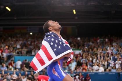 USA's Jordan Burroughs celebrates after defeating Iran's Sadegh Goudarzi in their men's 74kg freestyle gold medal match. Burroughs, the poster boy of American wrestling, lived up to all the pre-London 2012 hype by adding Olympic gold to his world title in the men's 74kg freestyle category. (AFP Photo/Marwan Naamani)