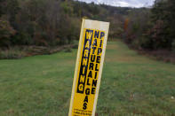 In this Oct. 17, 2019, photo, a post marks the location of a shale gas pipeline in Zelienople, Pa. President Donald Trump has aligned with Pennsylvania's natural gas industry, but his support for the industry in the nation's No. 2 natural gas state may not yield the expected political boost in what is perhaps the nation's premier presidential battleground state. In parts of the state critical to his path to victory, opposition to fracking is growing and calls for getting tough on the industry are popular. (AP Photo/Keith Srakocic)