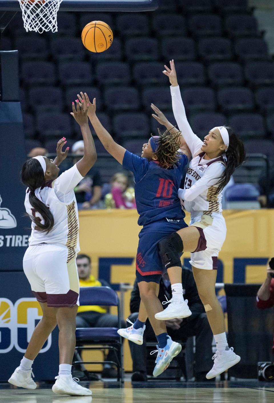 Janelle Jones (10), a Booker T. Washington High School graduate, fights for a rebound during South Alabama vs. Texas State women’s basketball game in the first round of the Sun Belt Conference championship tournament at the Pensacola Bay Center in Pensacola on Wednesday, March 2, 2022.